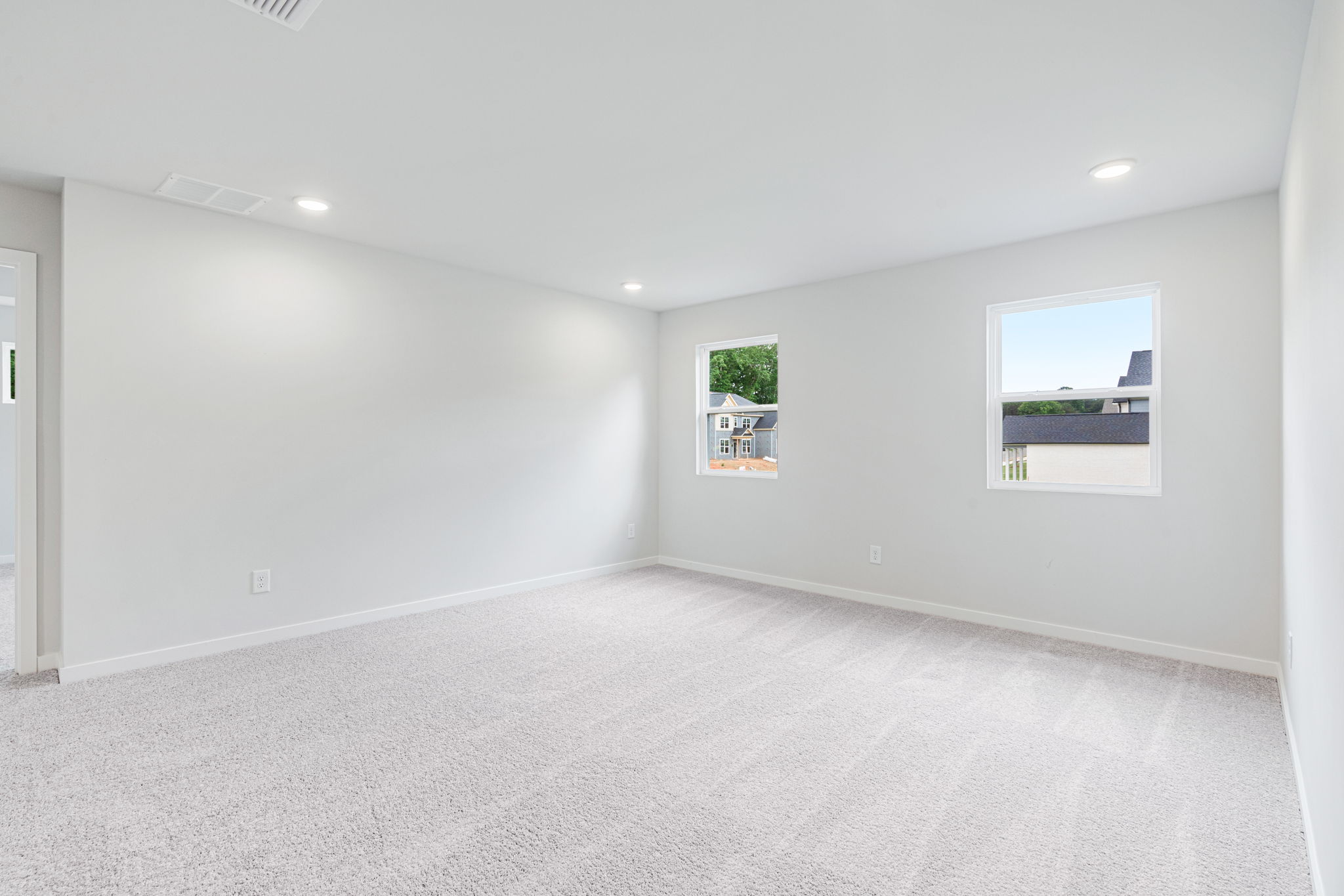 A room with a painting on the wall.