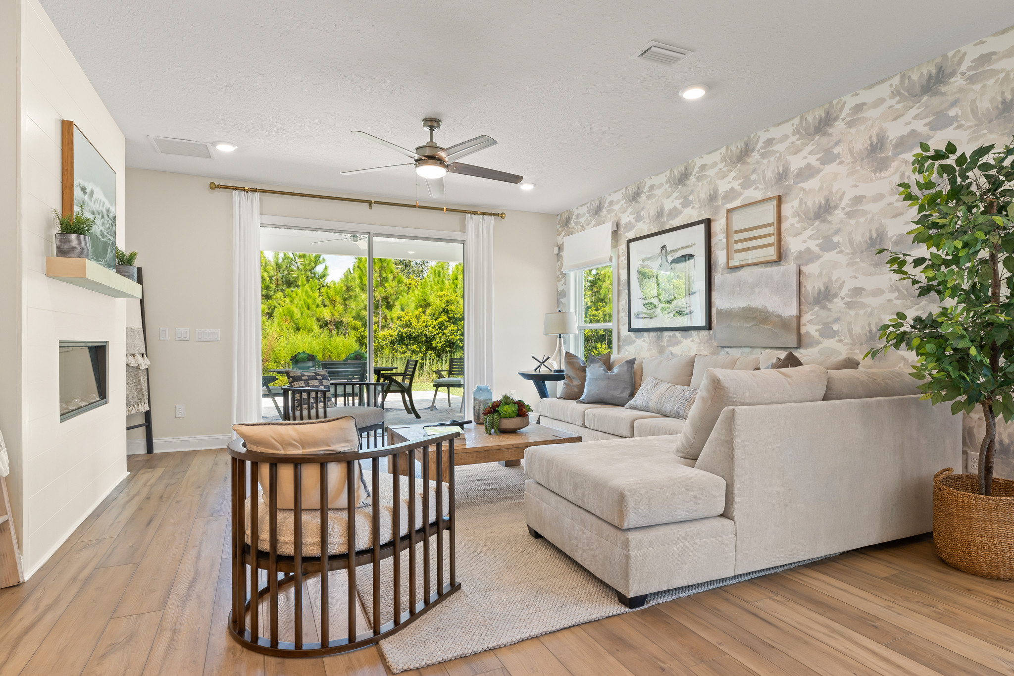 A living room with a large glass door.