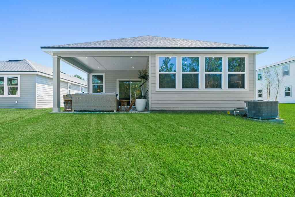 A house with a lawn in front.