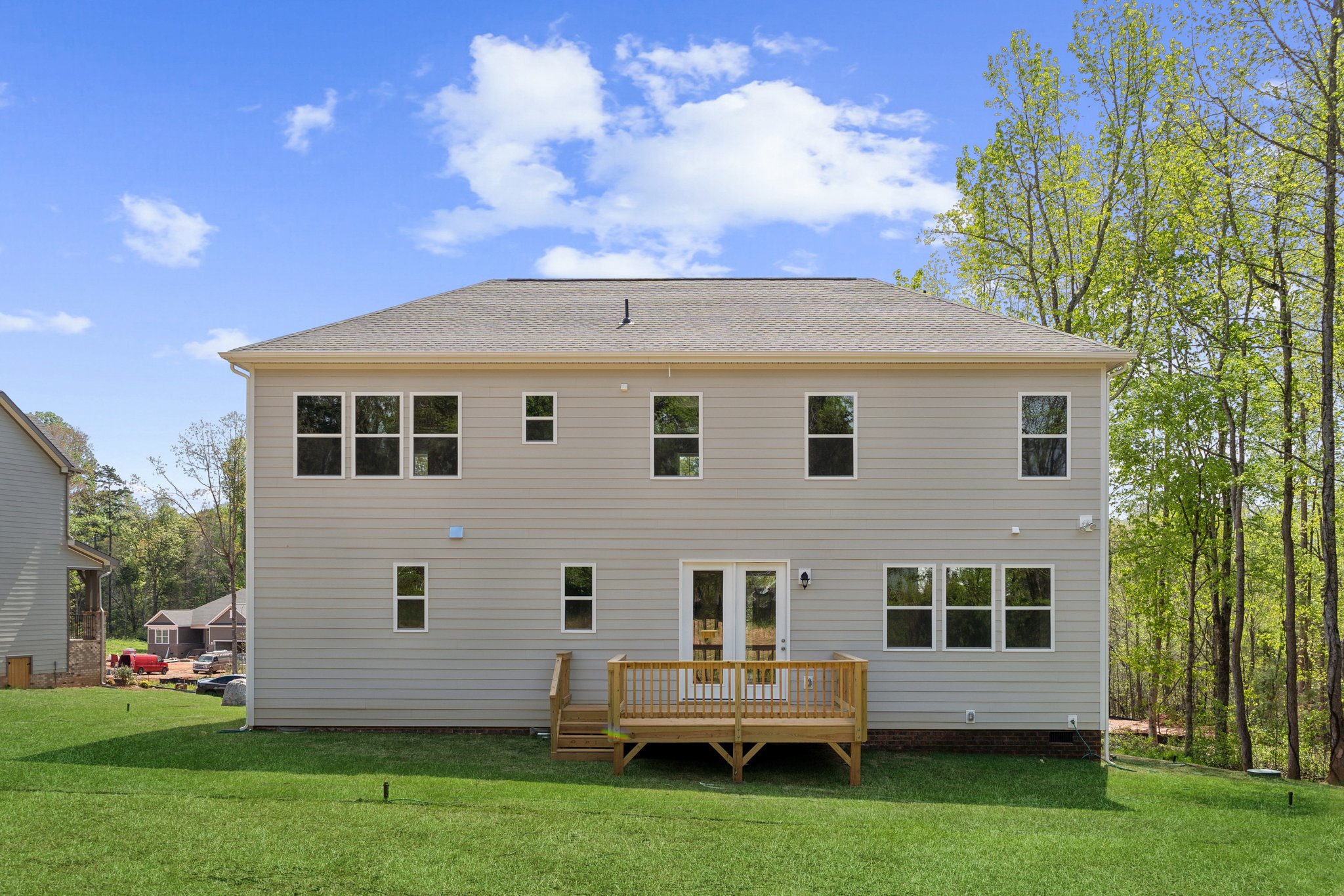 A house with a bench in the front.