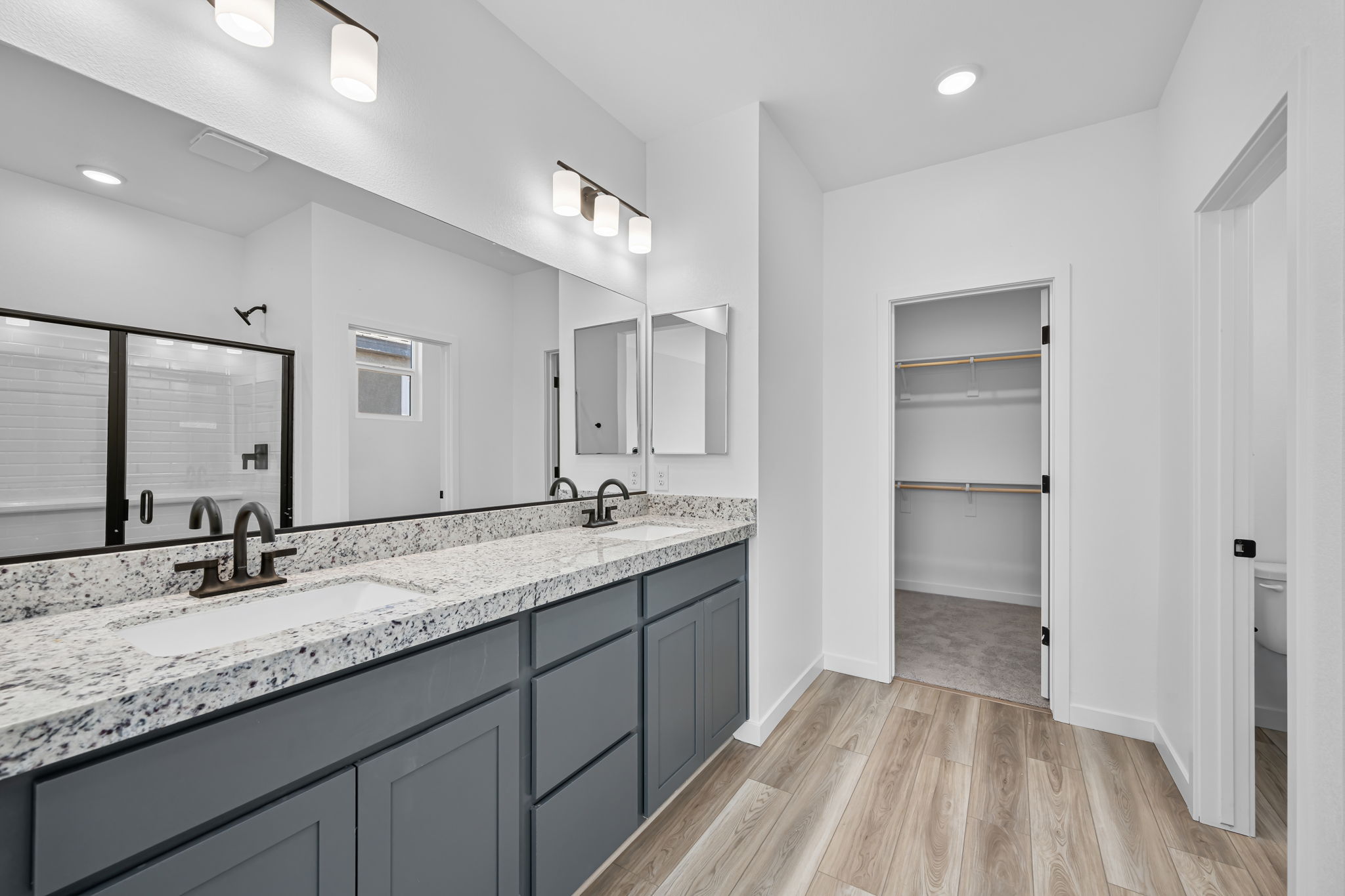 A modern bathroom with a marble countertop.
