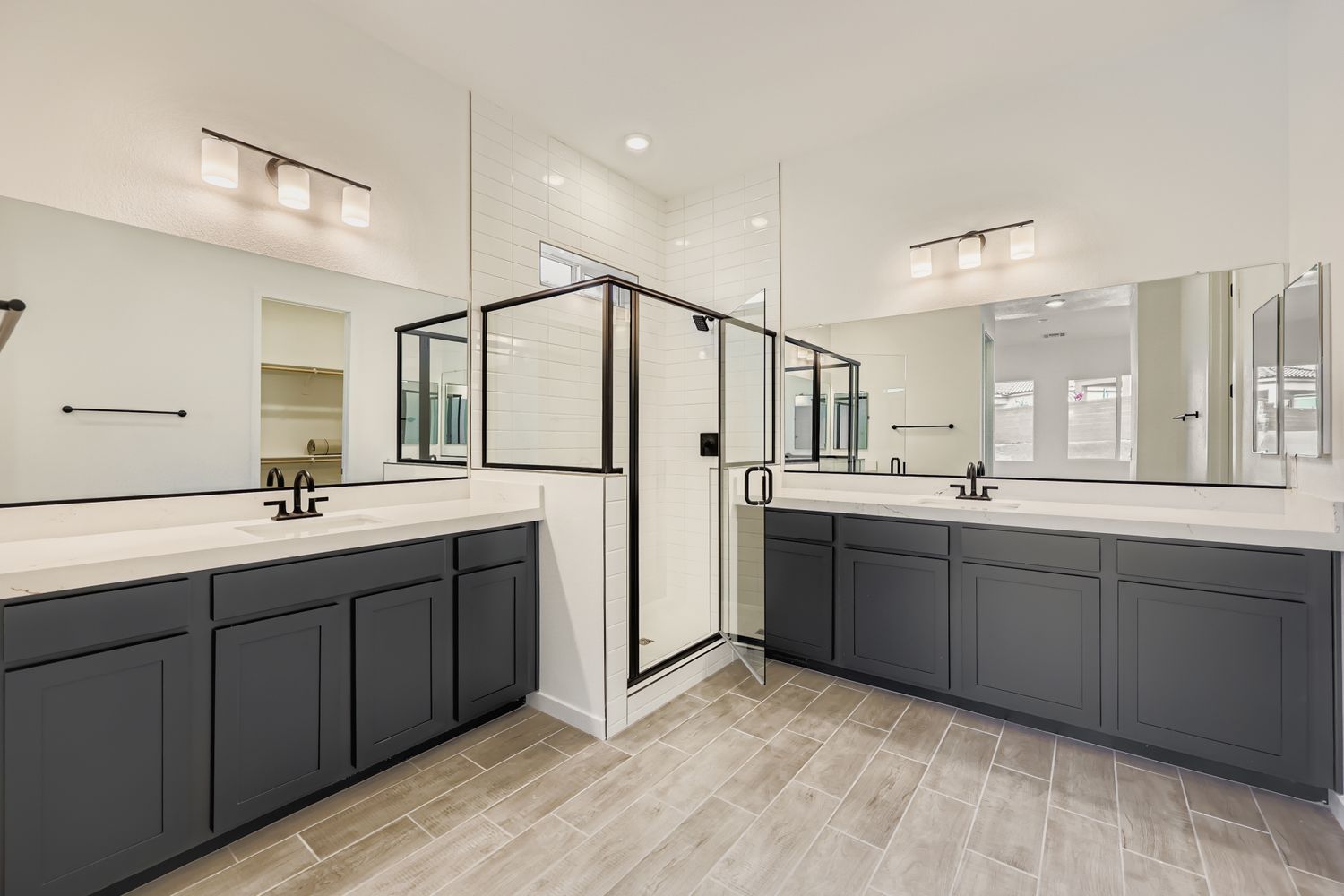 A modern kitchen with black cabinets.