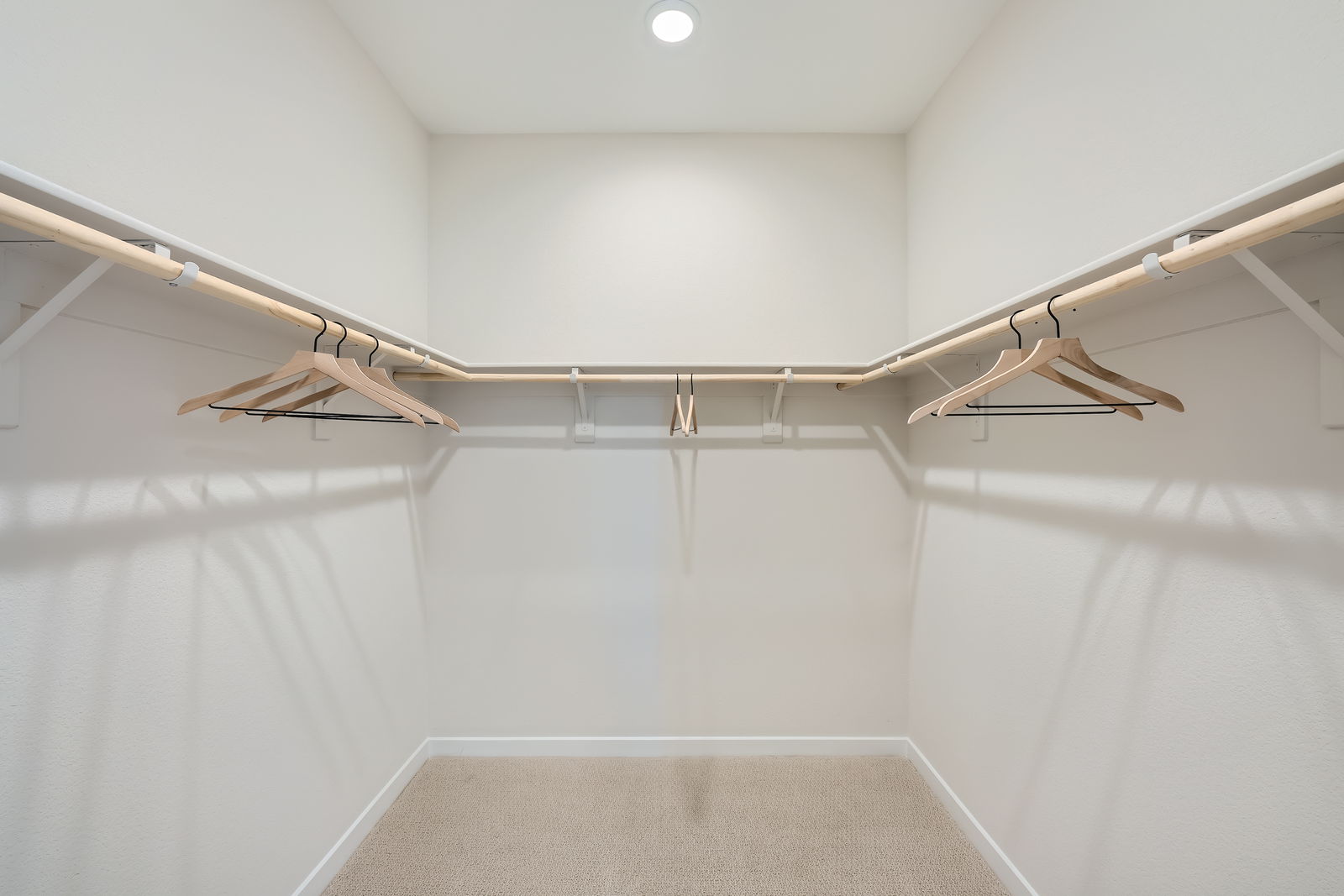 A white room with a white wall and a white floor.