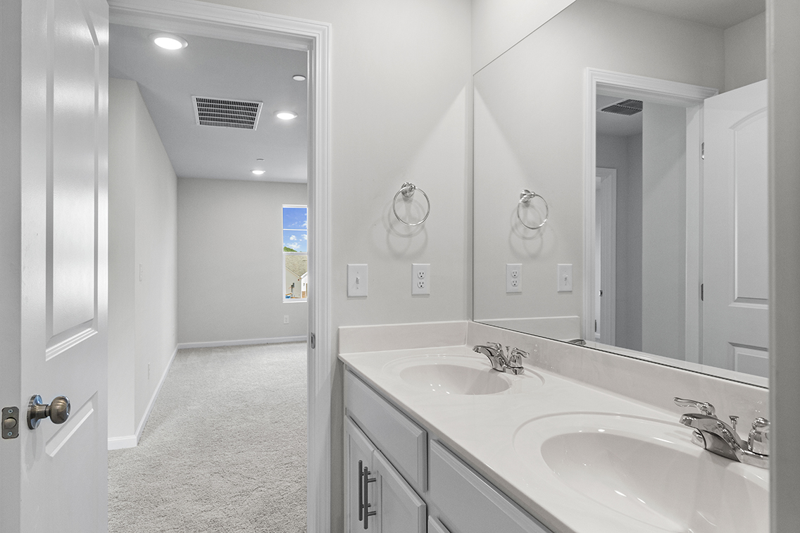 A bathroom with two sinks.