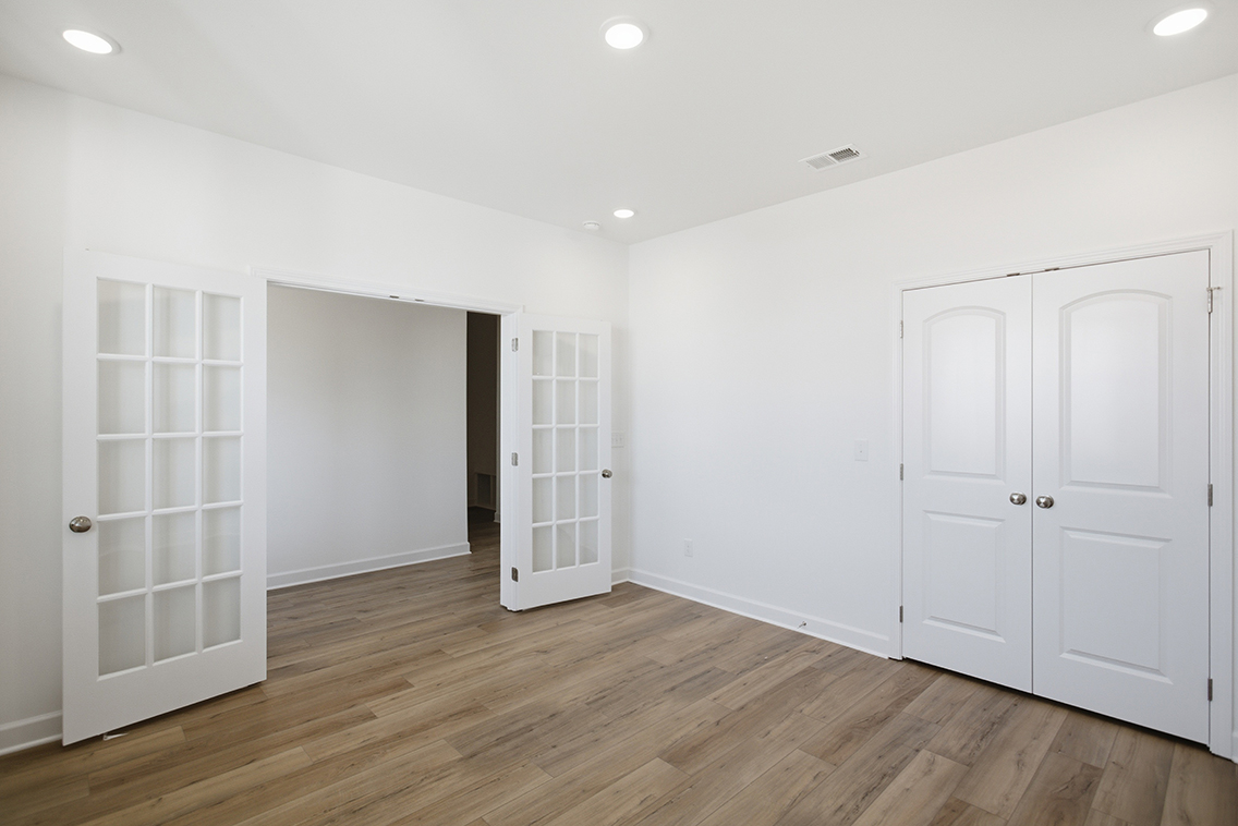 A room with white doors.