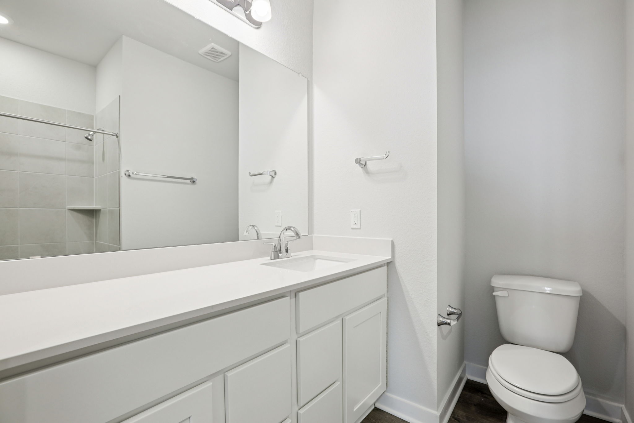 A bathroom with a standup shower.