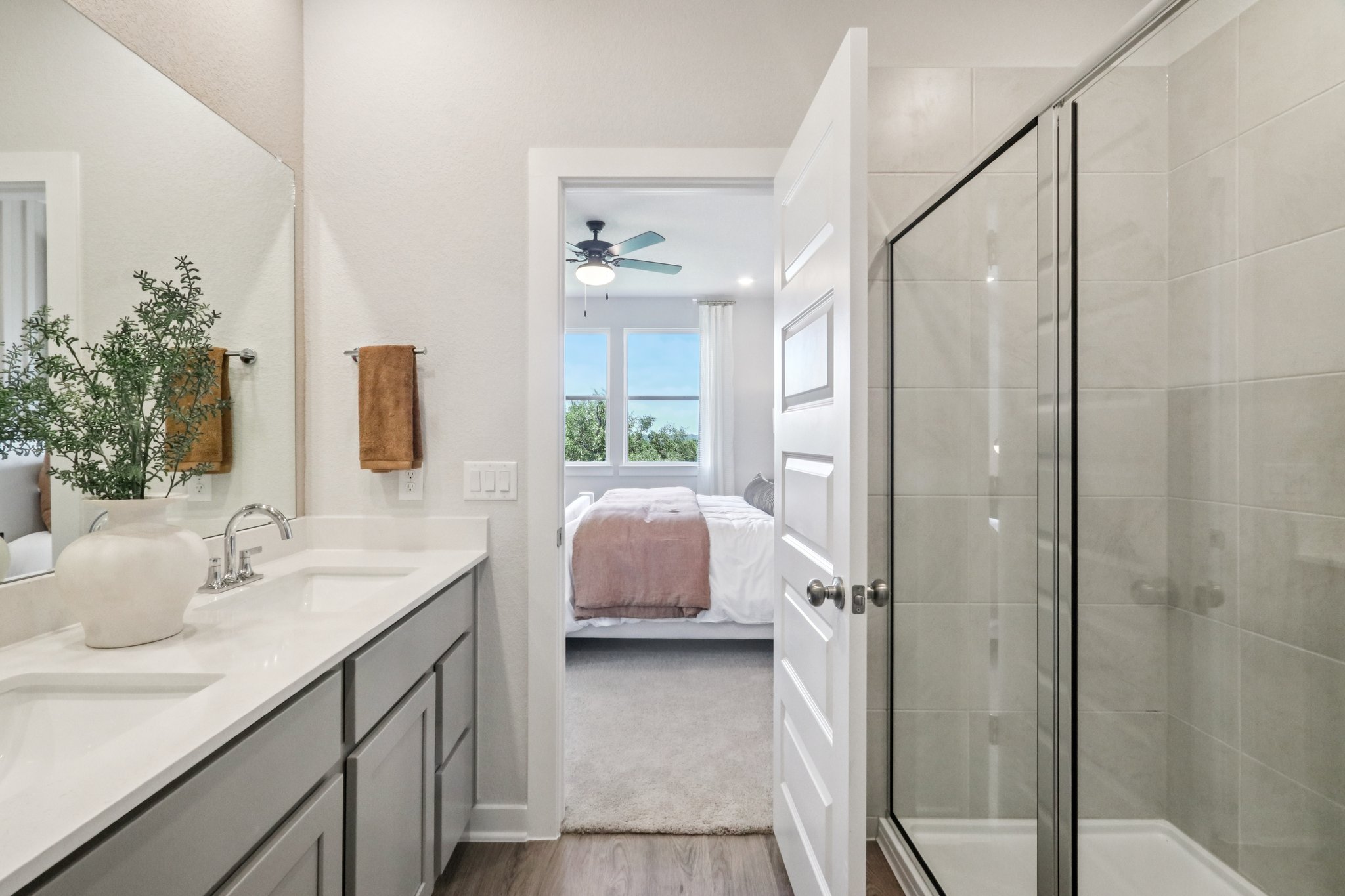 A bathroom with a glass shower.