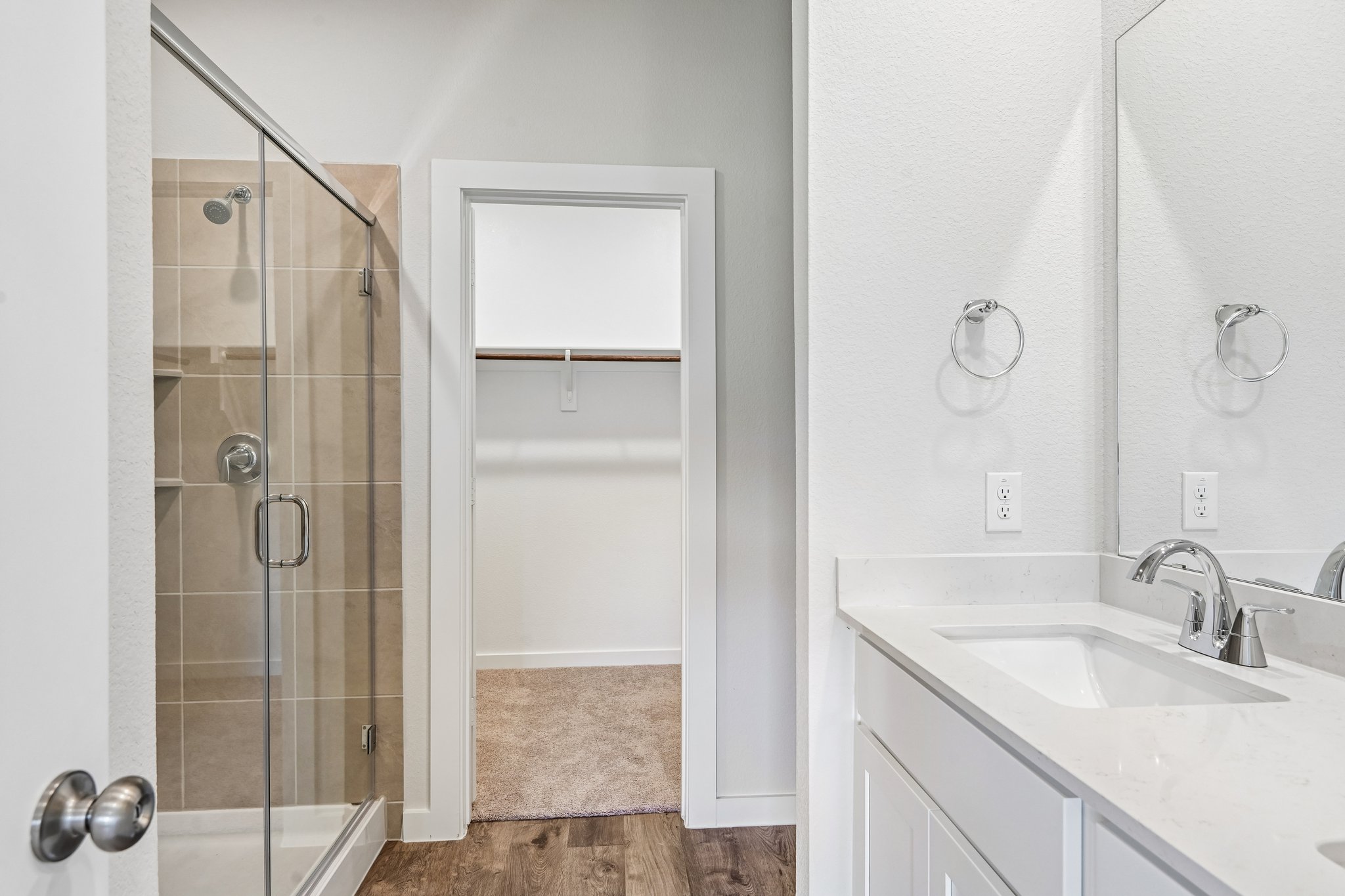 A bathroom with a glass shower.