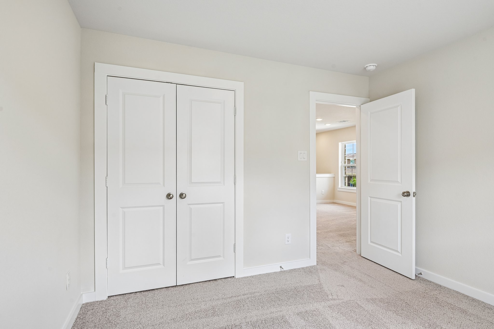 A room with white doors.