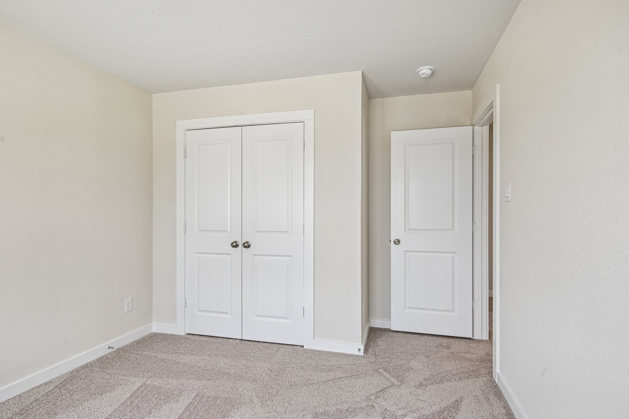 A room with white doors.
