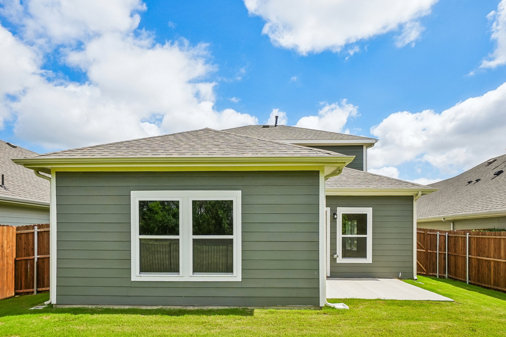 A house with a green lawn.