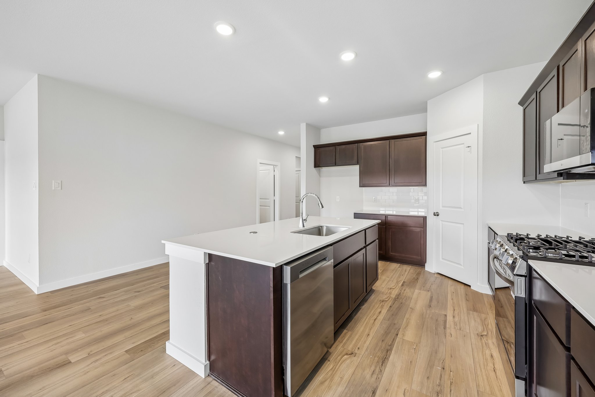 A kitchen with wooden cabinets.