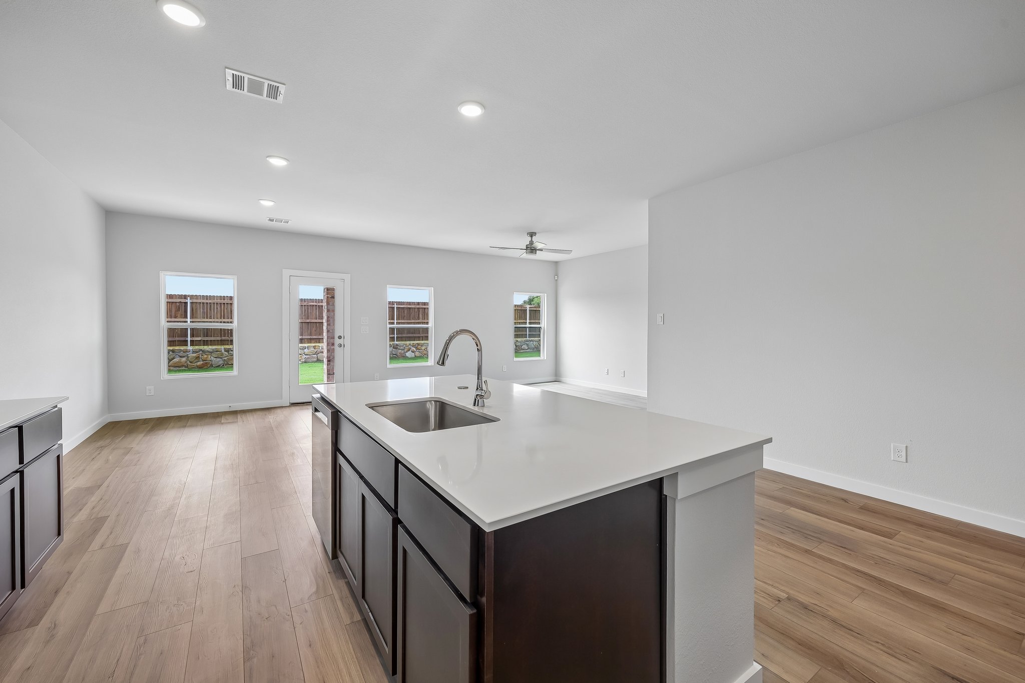 A kitchen with a sink and cabinets.