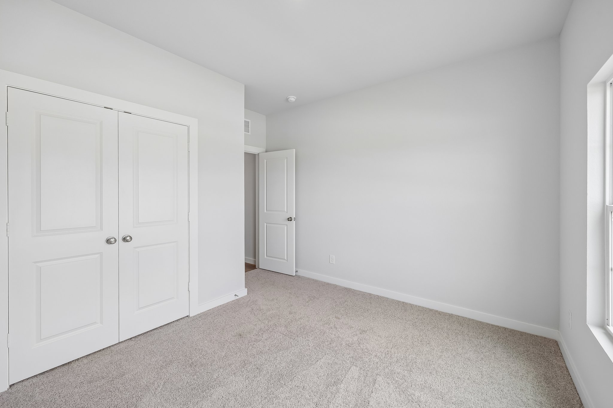 A room with white doors.