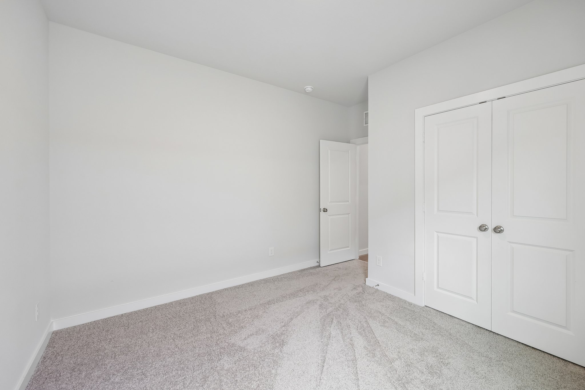 A room with white doors.