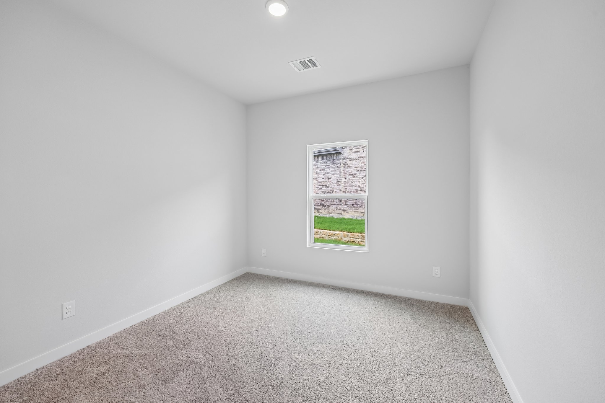 A hallway with a sign on the wall.