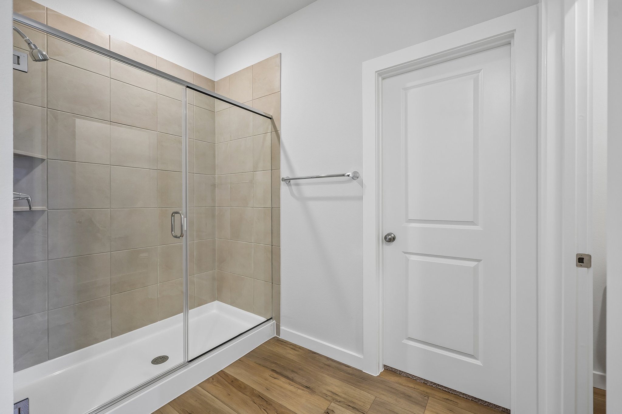 A bathroom with a glass shower.