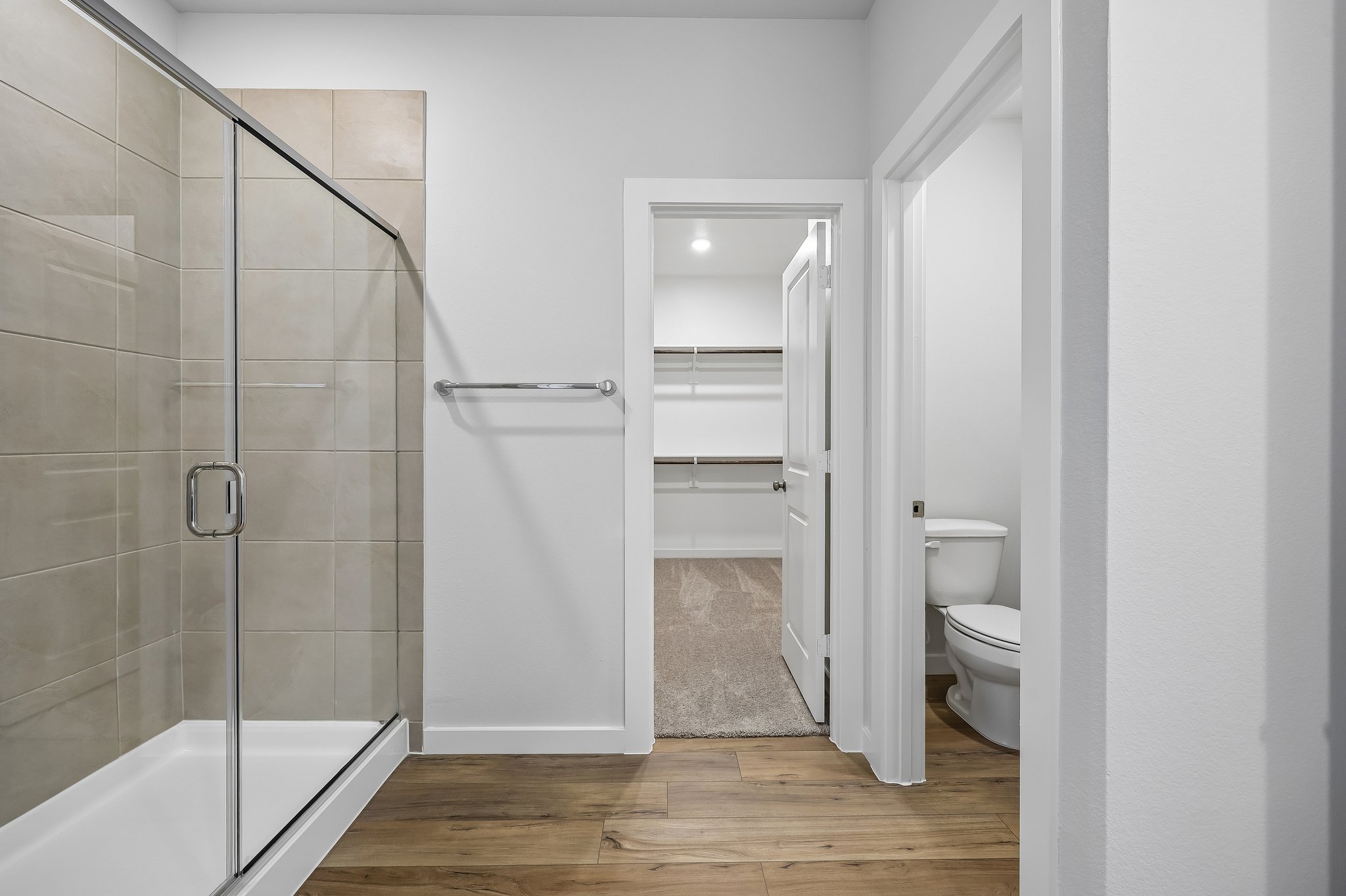 A bathroom with a glass shower.