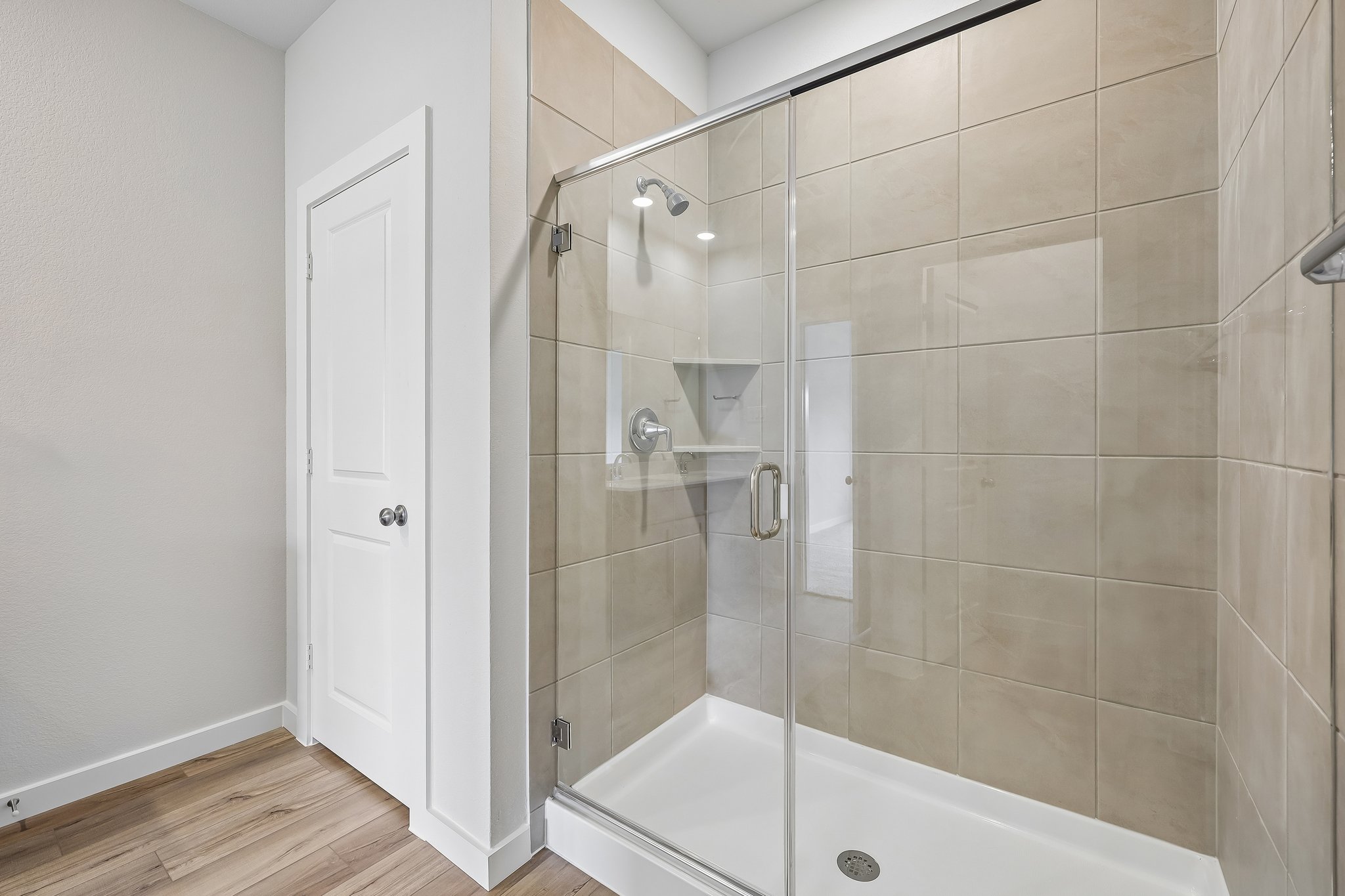 A bathroom with a glass shower.