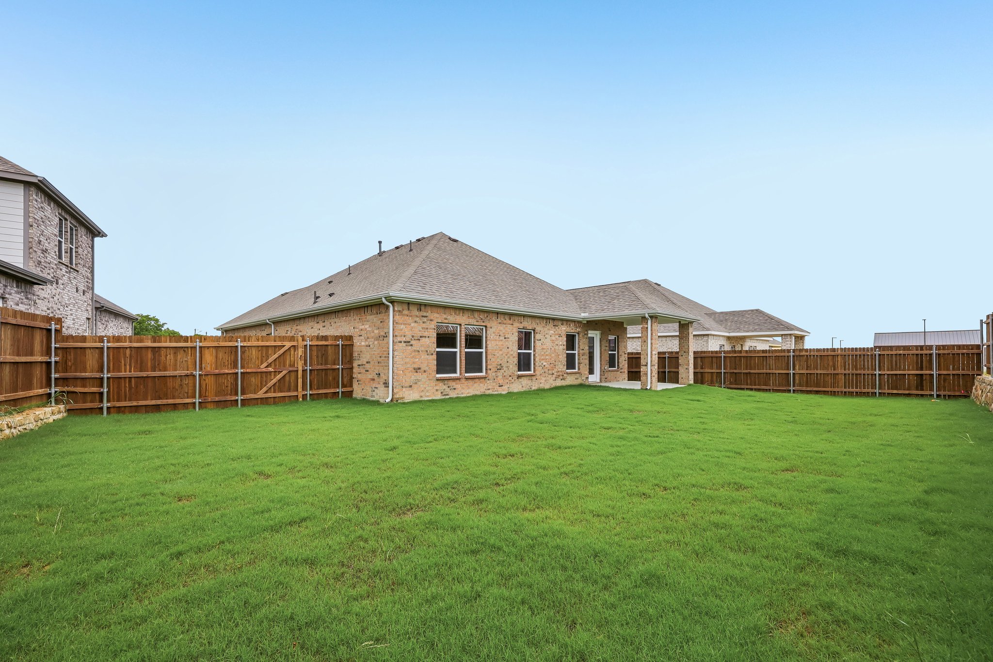 A large house with a fence.