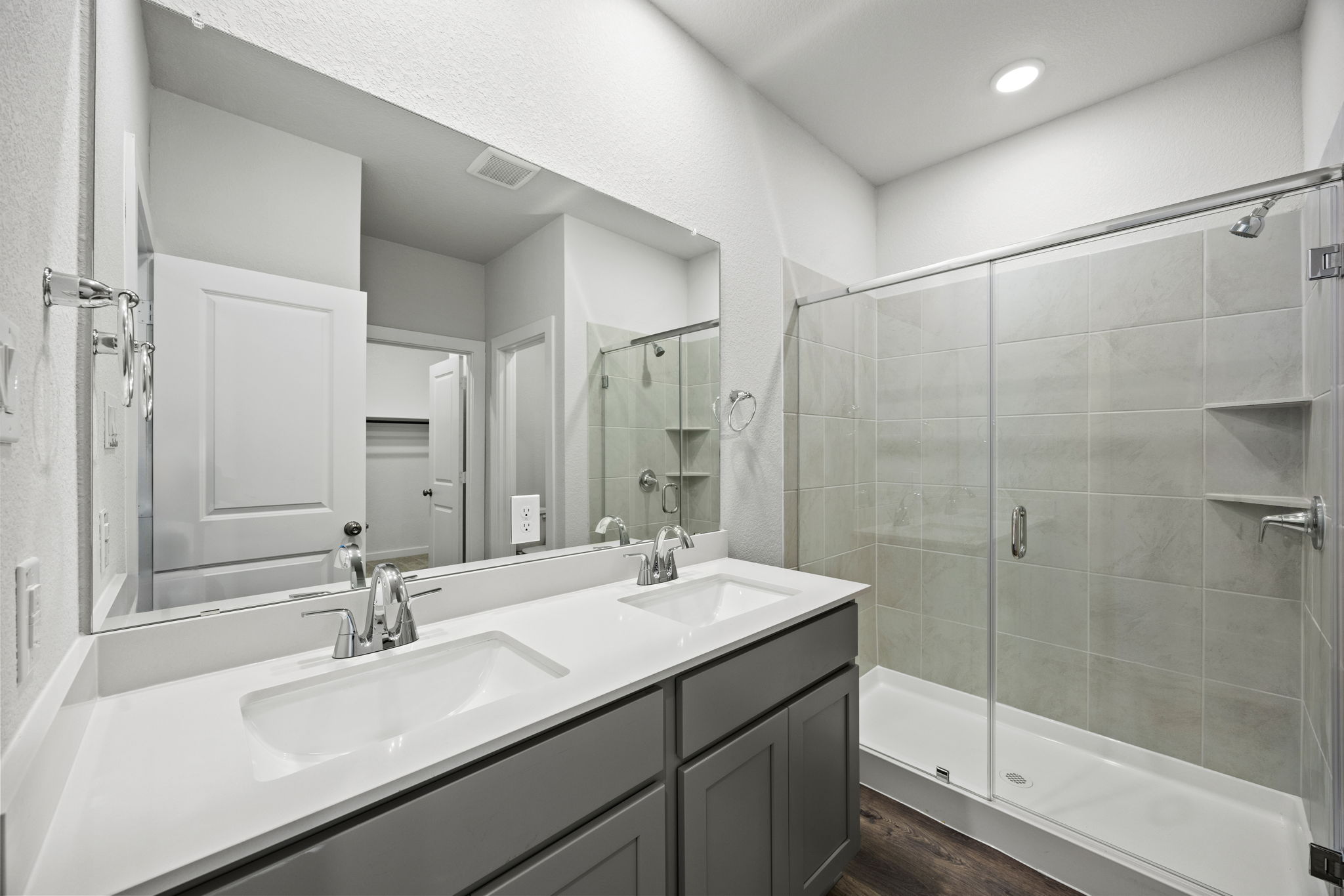 A bathroom with a glass shower.