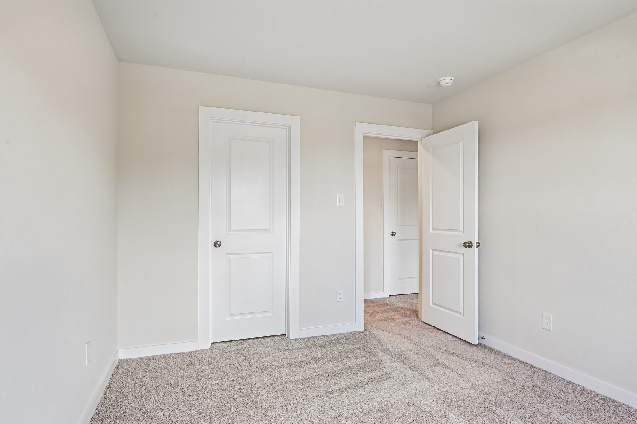 A room with white doors.