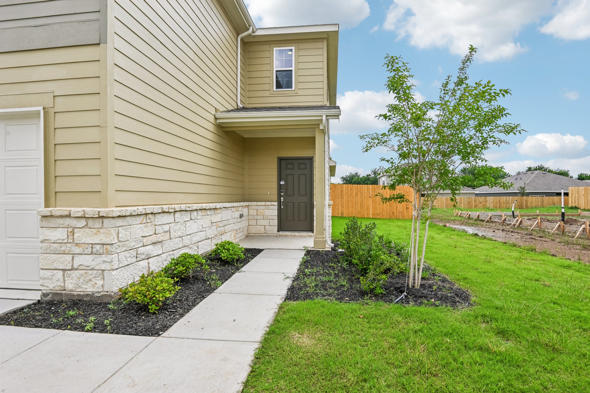 A house with a small yard.