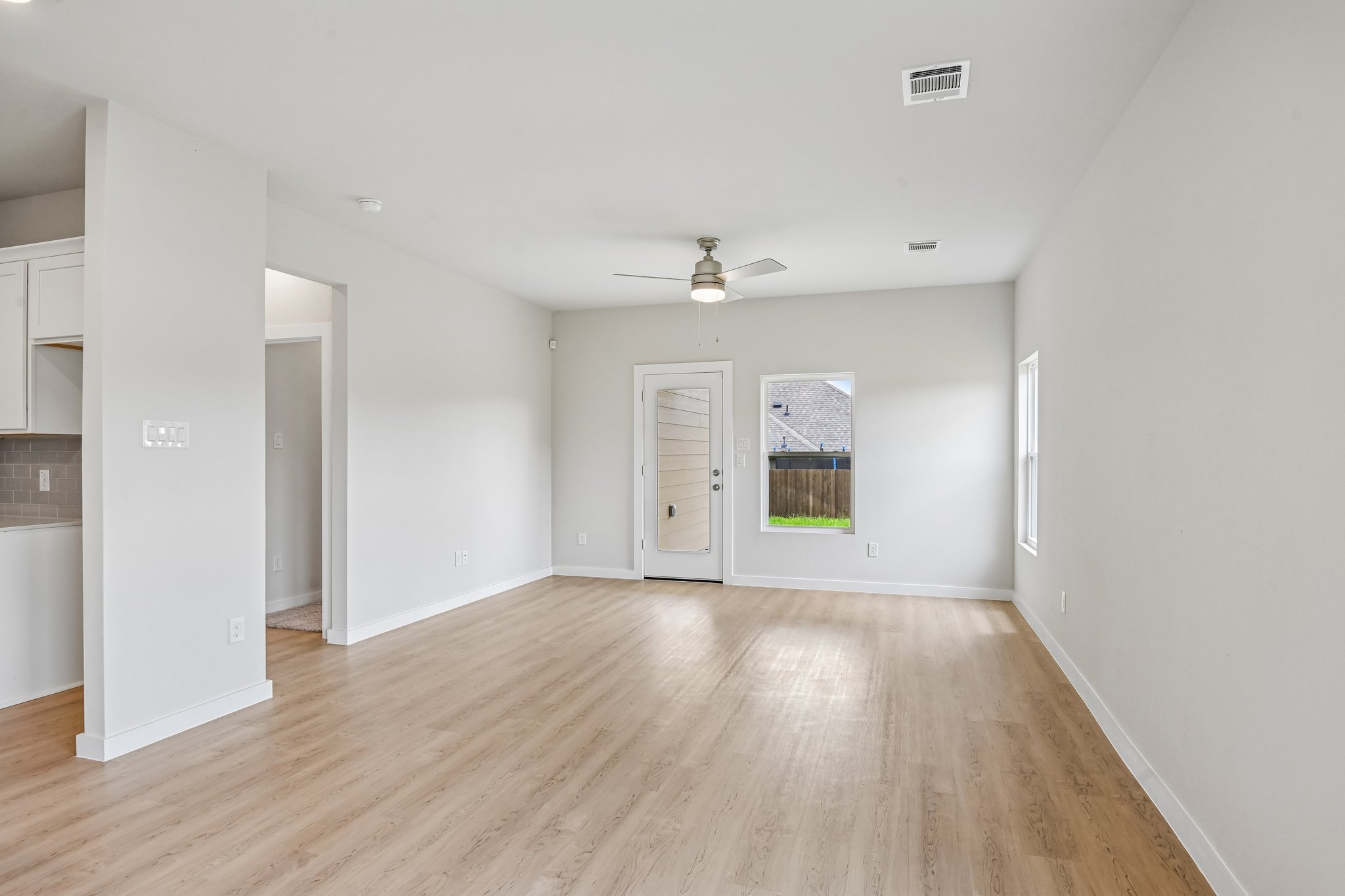 A room with a wood floor and a wood floor.