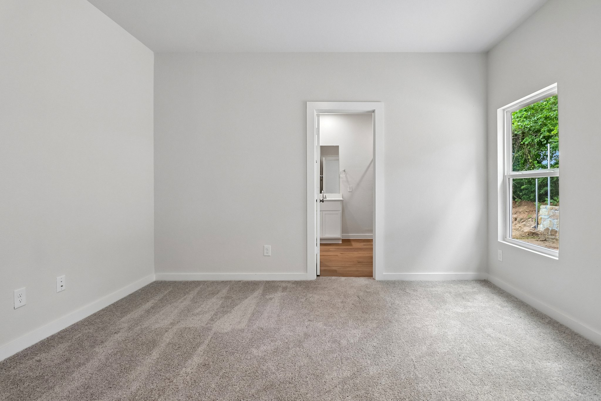 A room with a door and a window.