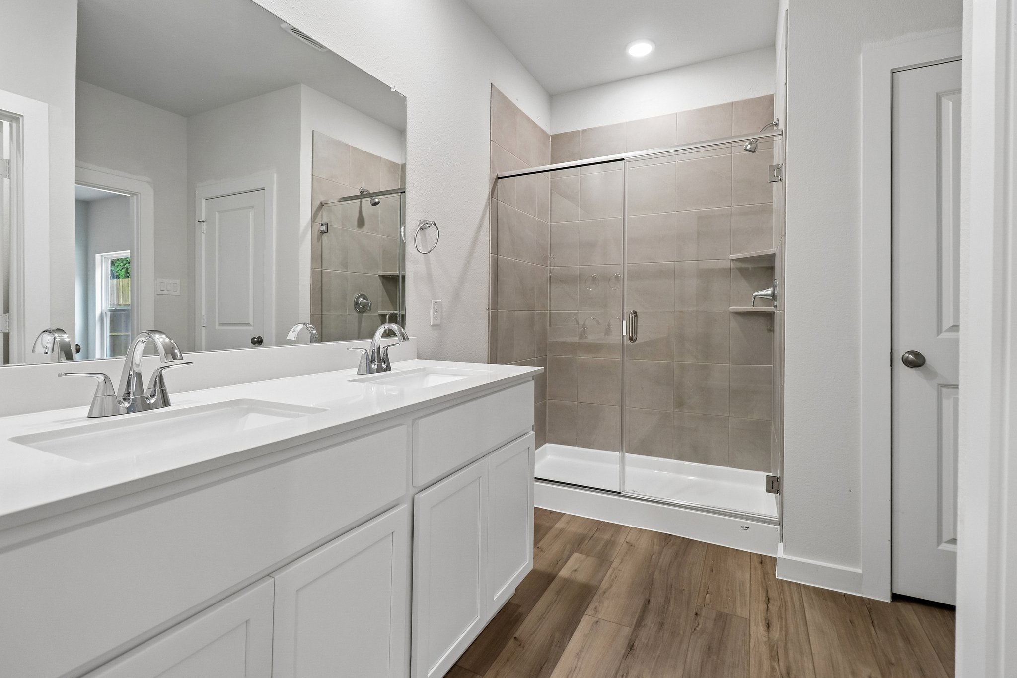 A bathroom with a glass shower.