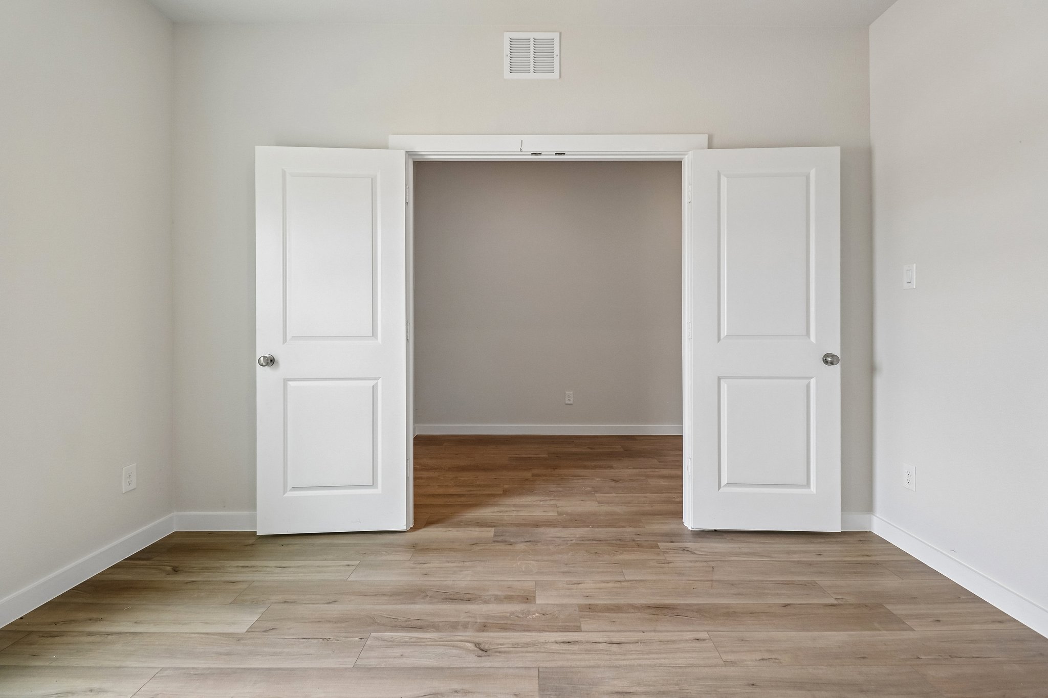 A room with white doors.