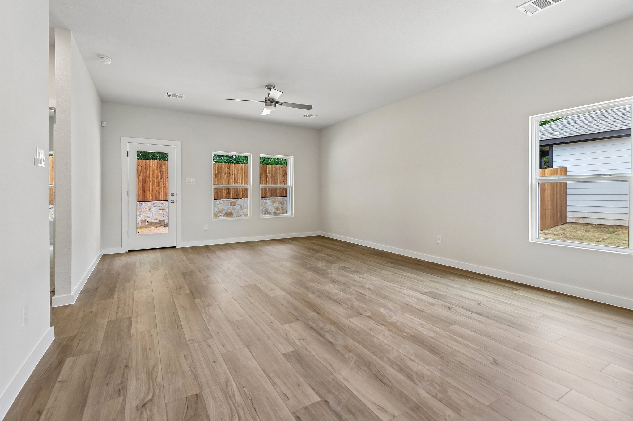 A room with a wood floor and a wood floor.