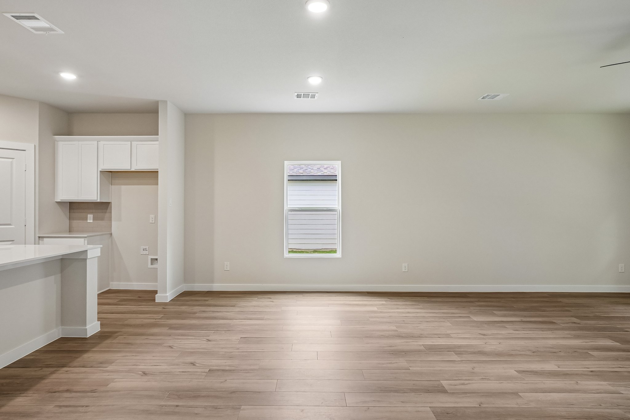 A room with white cabinets.