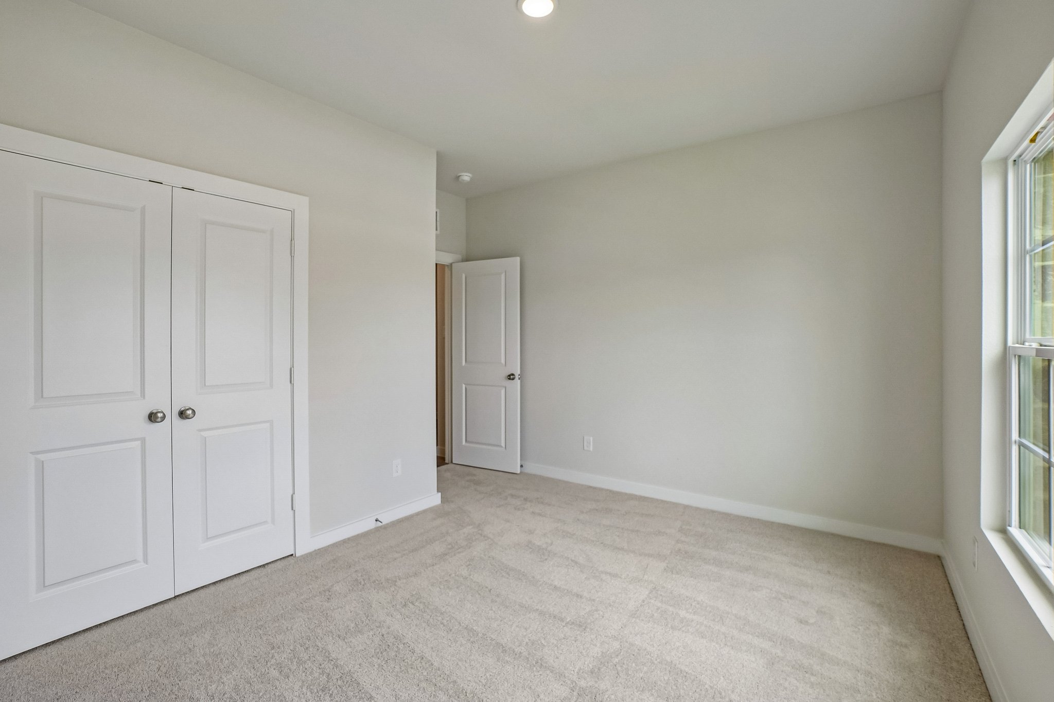 A room with white doors.