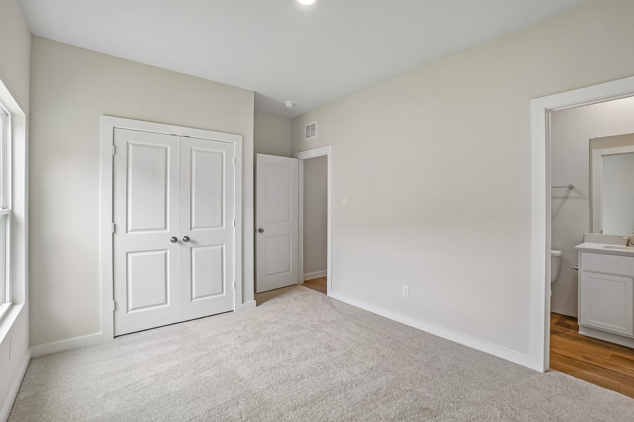 A room with white doors.