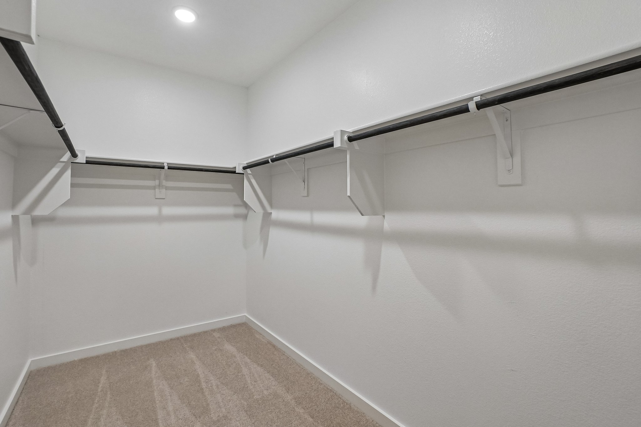 A white staircase with a light.