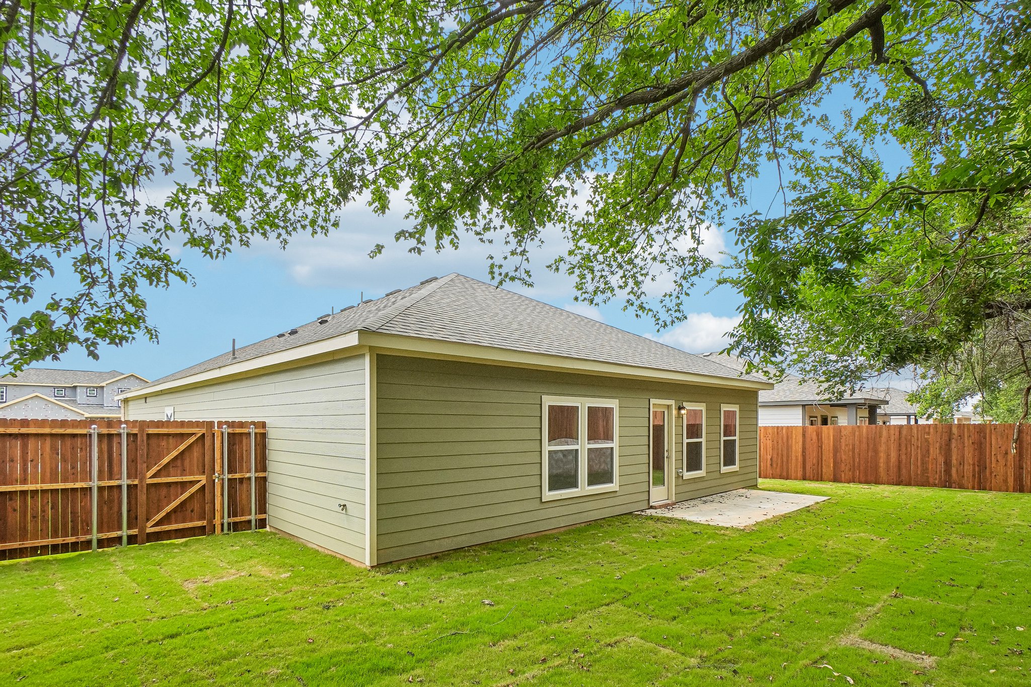 A small house in a yard.