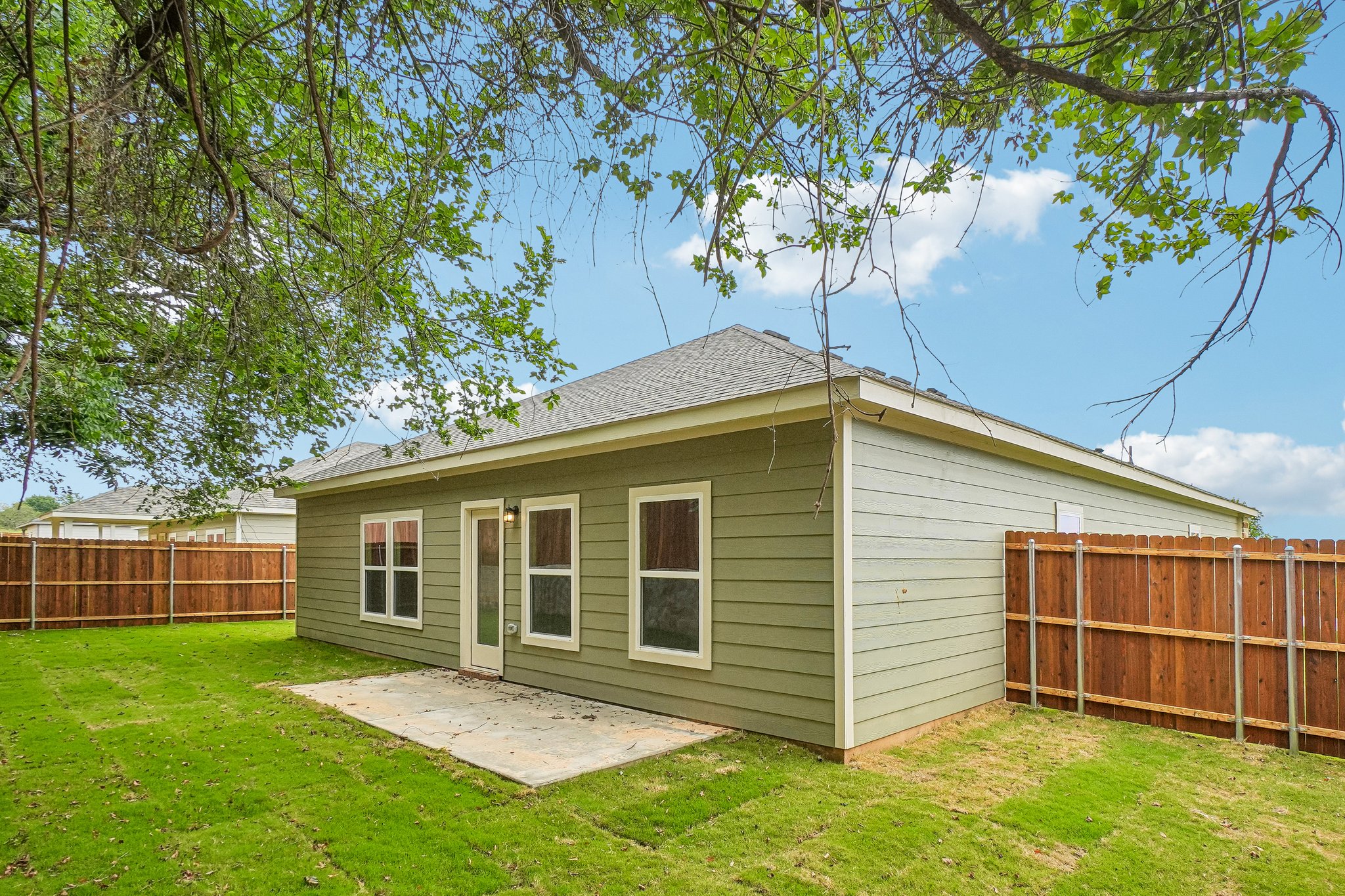 A small house in a yard.