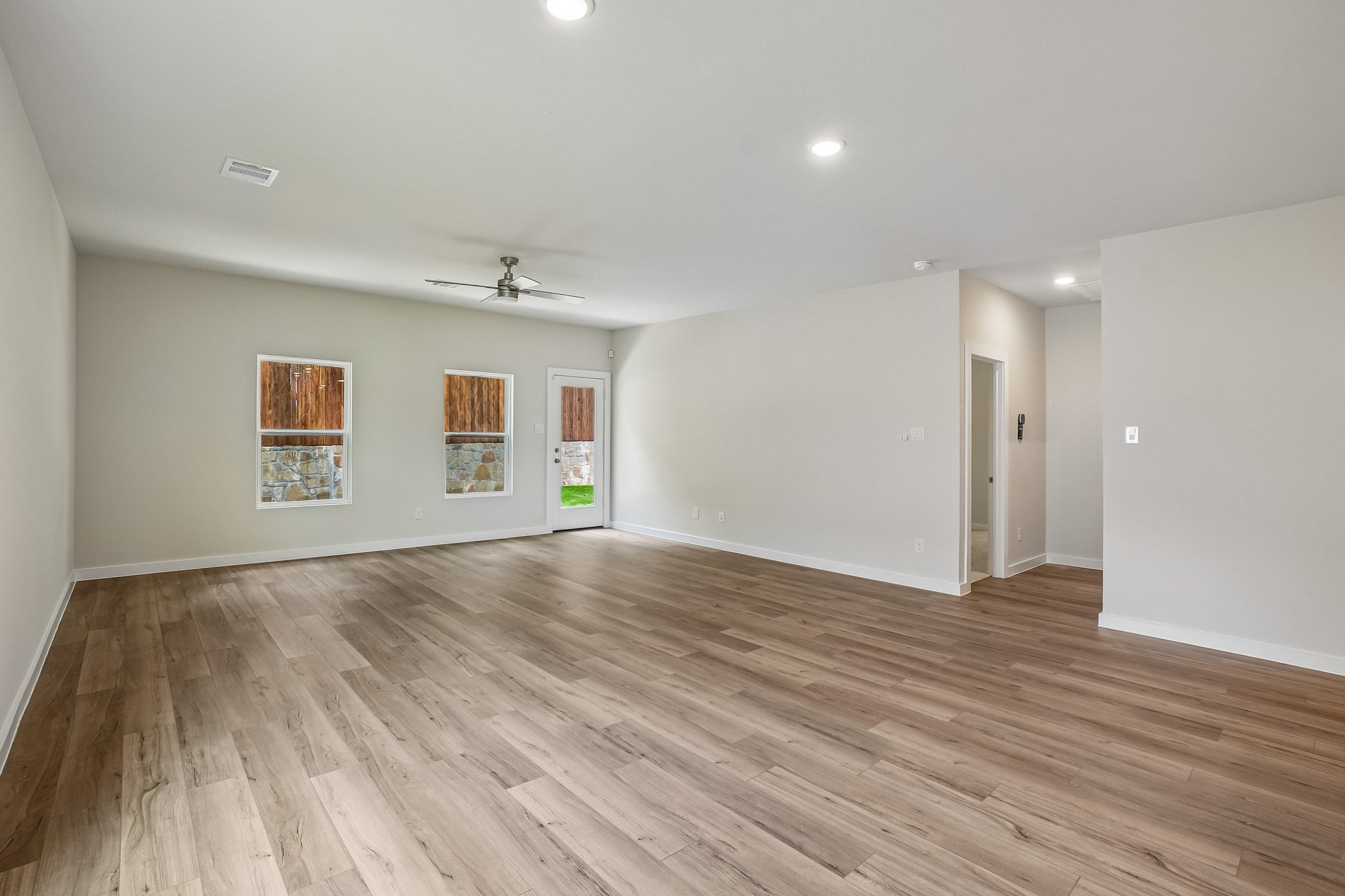 A room with a wood floor and a wood floor.