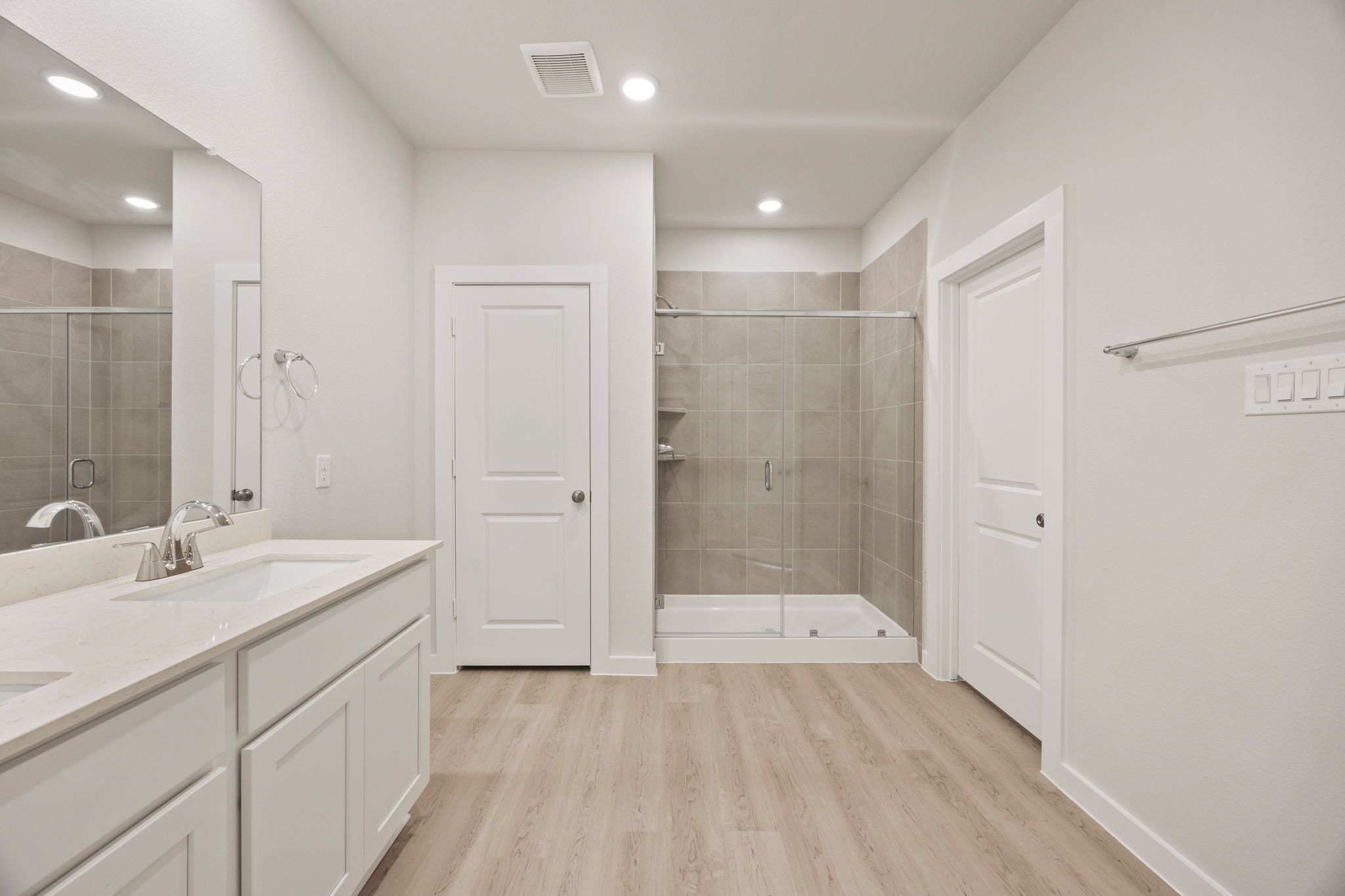 A bathroom with a glass shower.