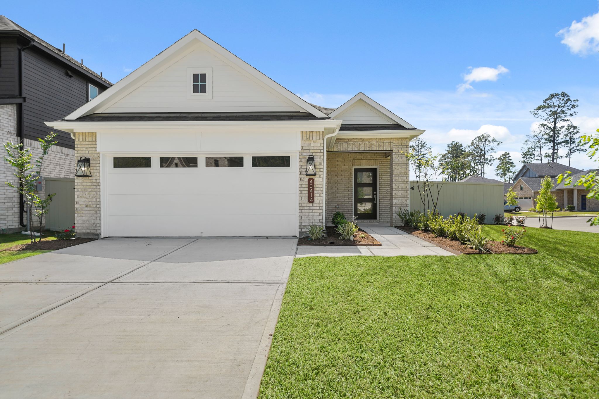 A white house with a driveway.