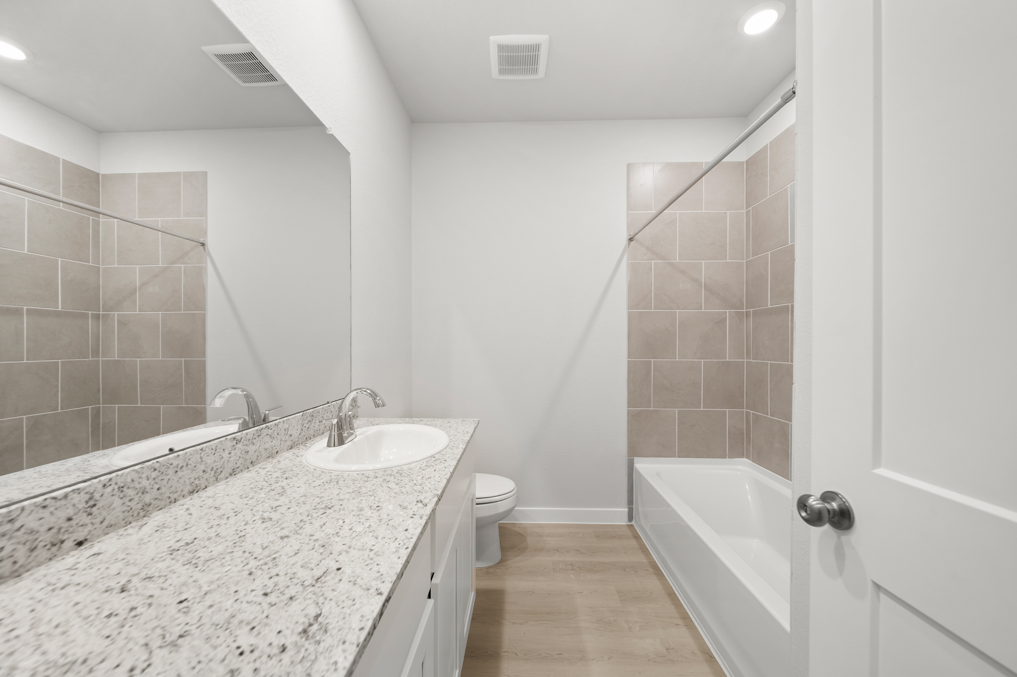 A bathroom with a marble countertop.