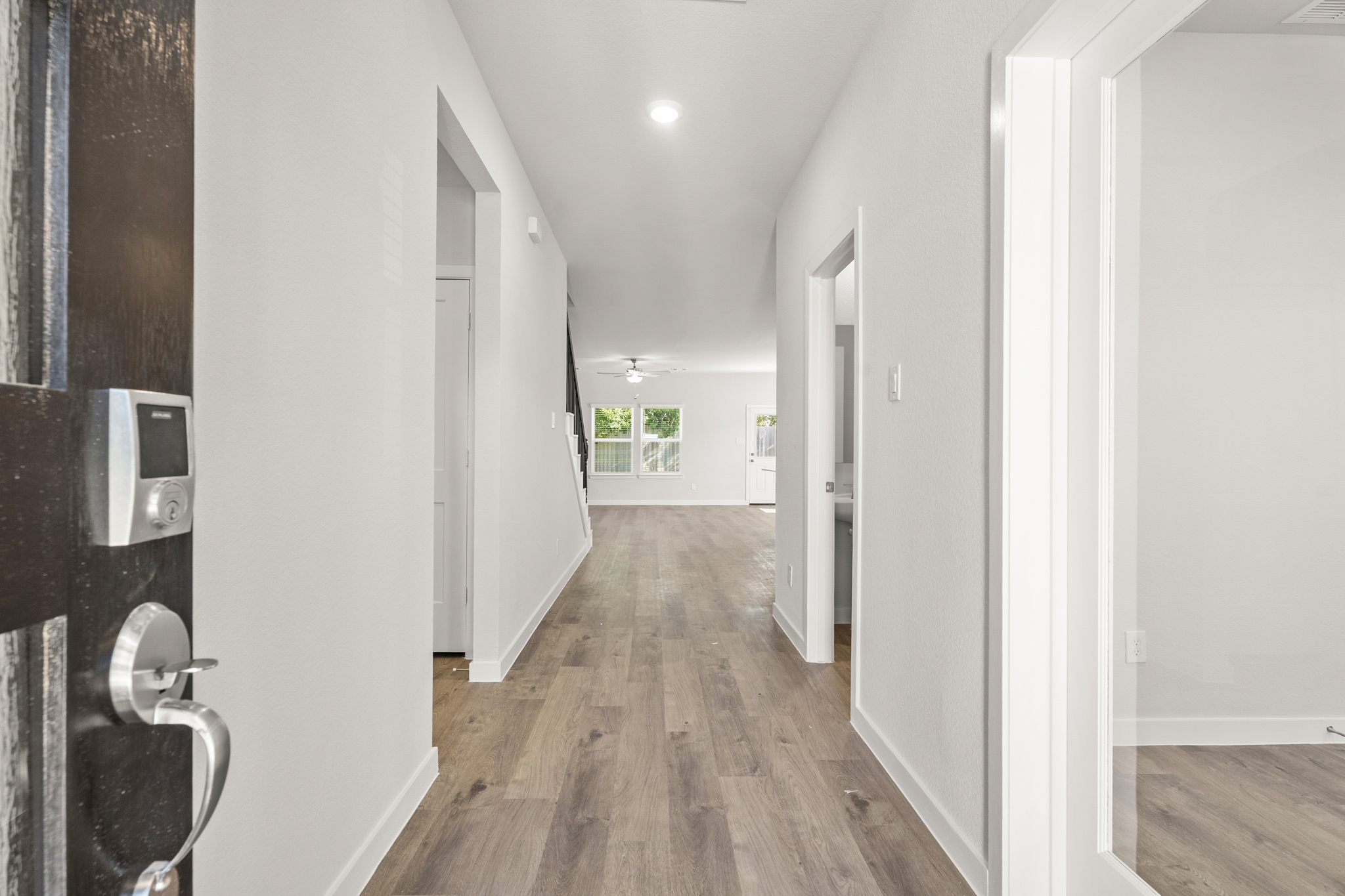 A hallway with white walls.
