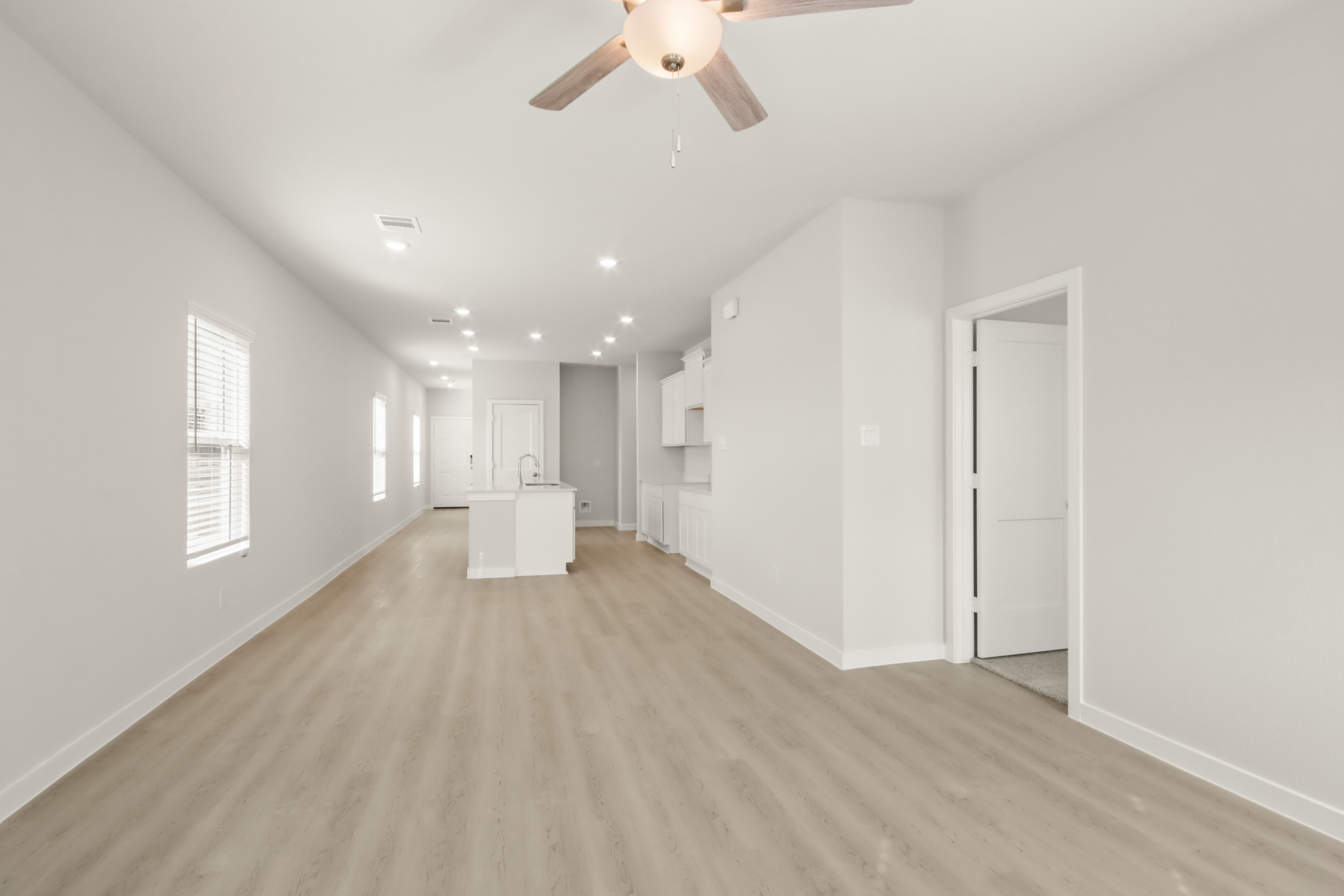 A large empty room with white walls.