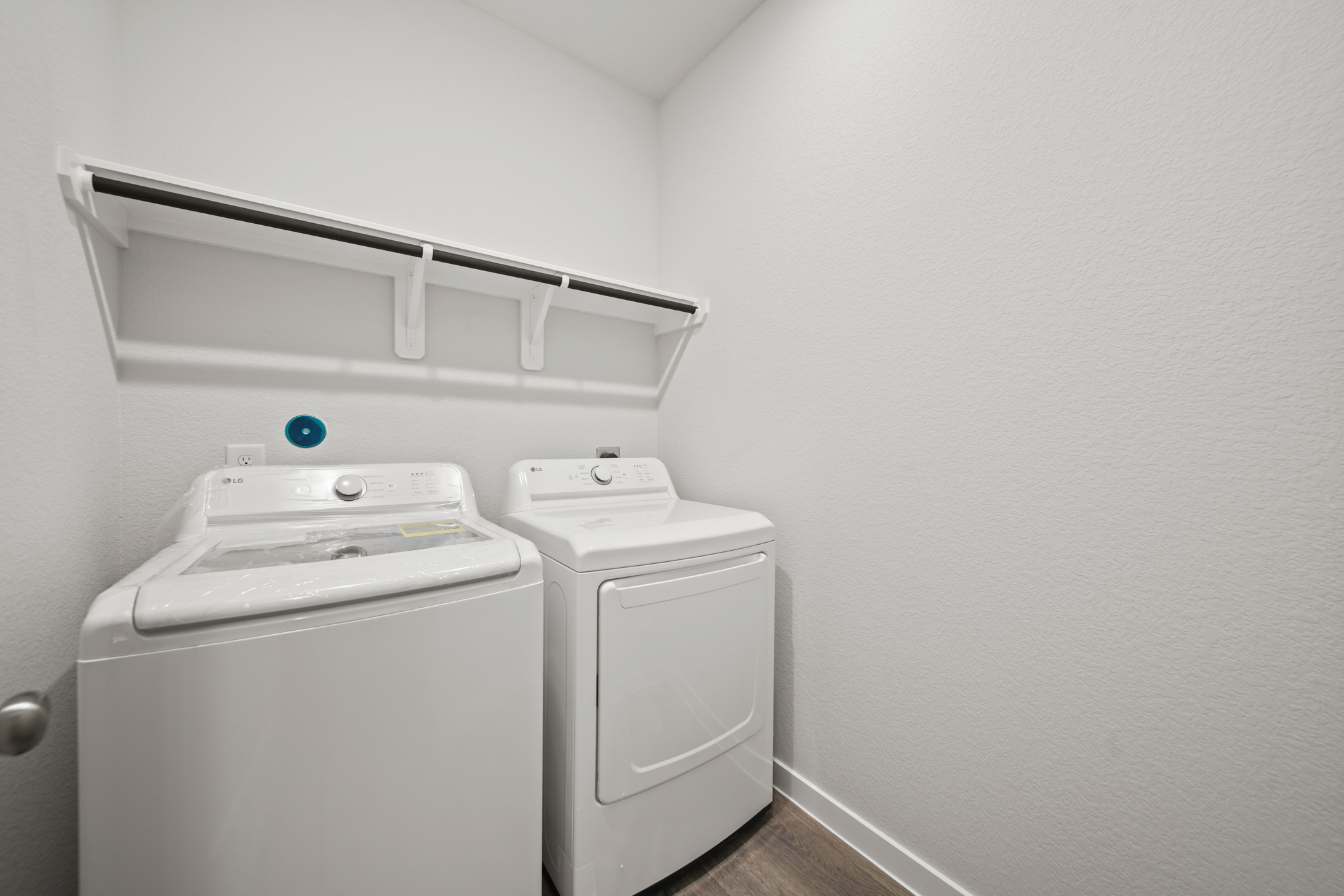 A washing machine in a room.