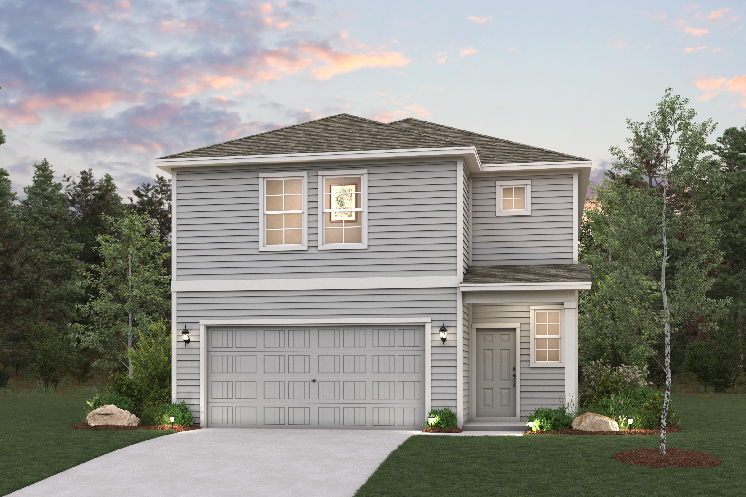 A house with a garage and trees.