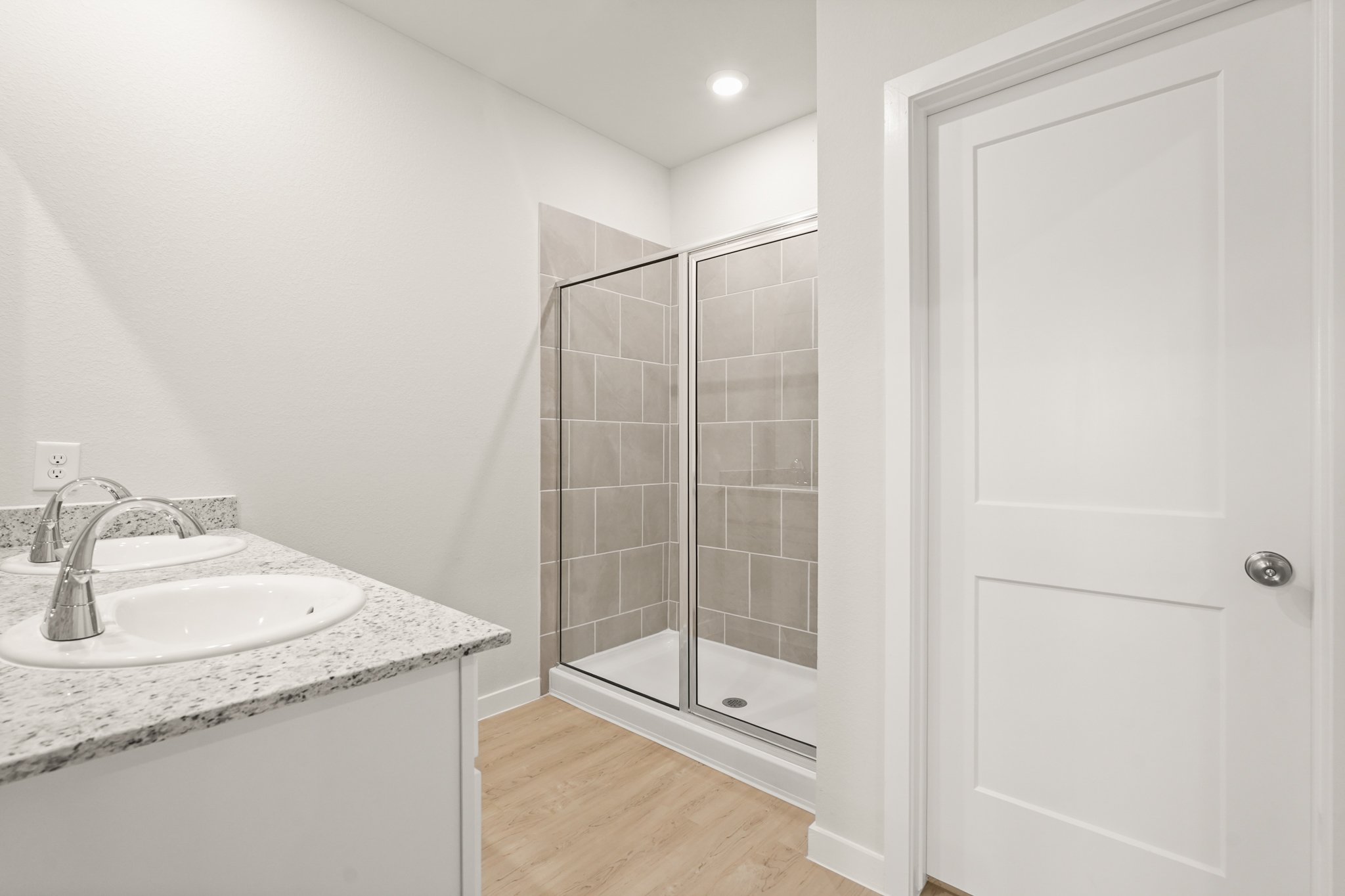 A bathroom with a glass shower.