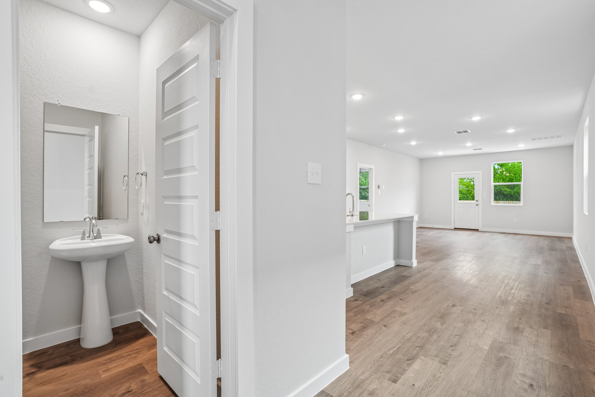 A bathroom with white walls.
