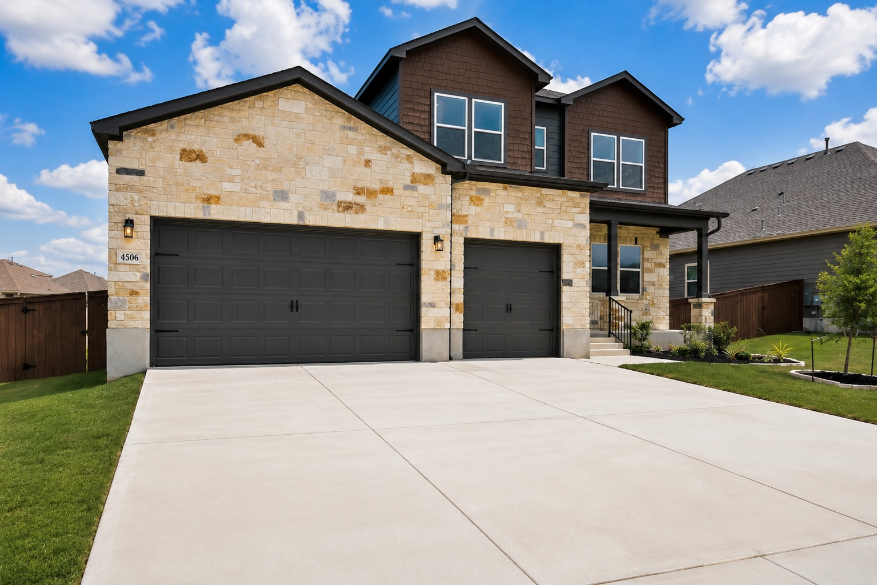 A building with garages and a driveway.