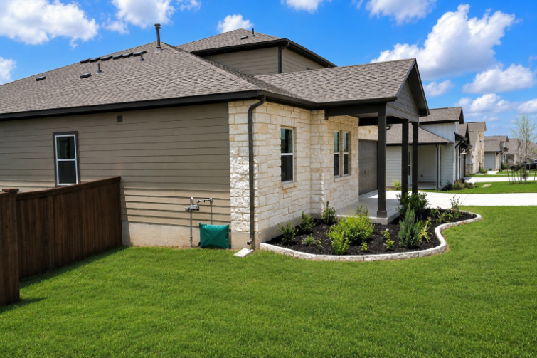 A house with a fence and a yard.